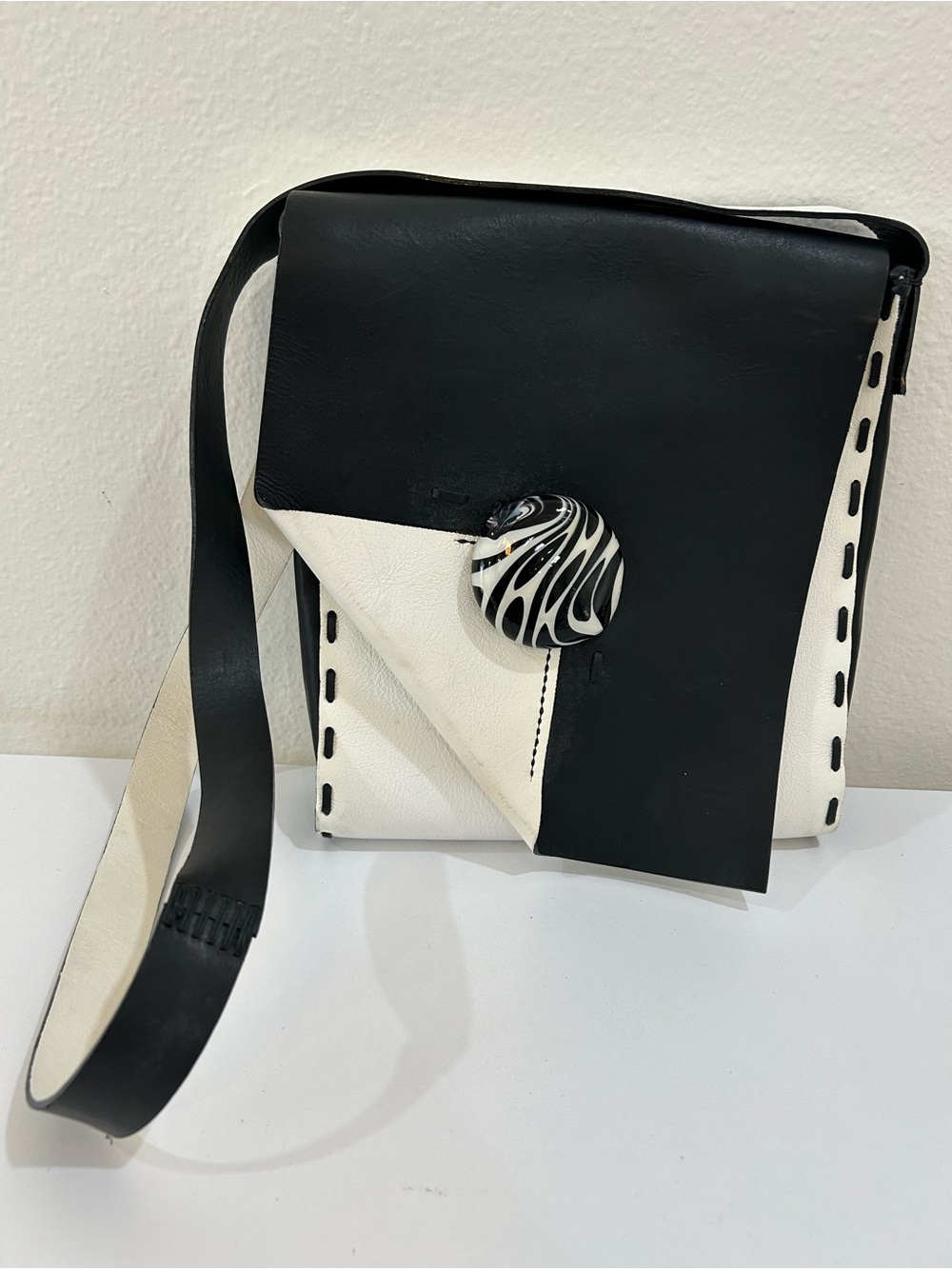 Raggio Veneziano Black and White Leather Crossbody Bag with Statement Button